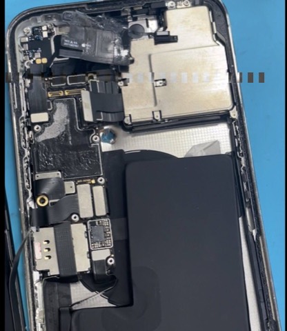 iPhone 14 Pro Max with bullet impacts