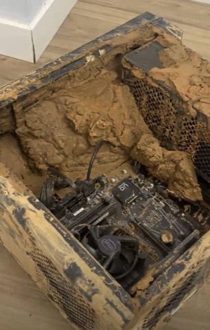 Desktop tower full of mud